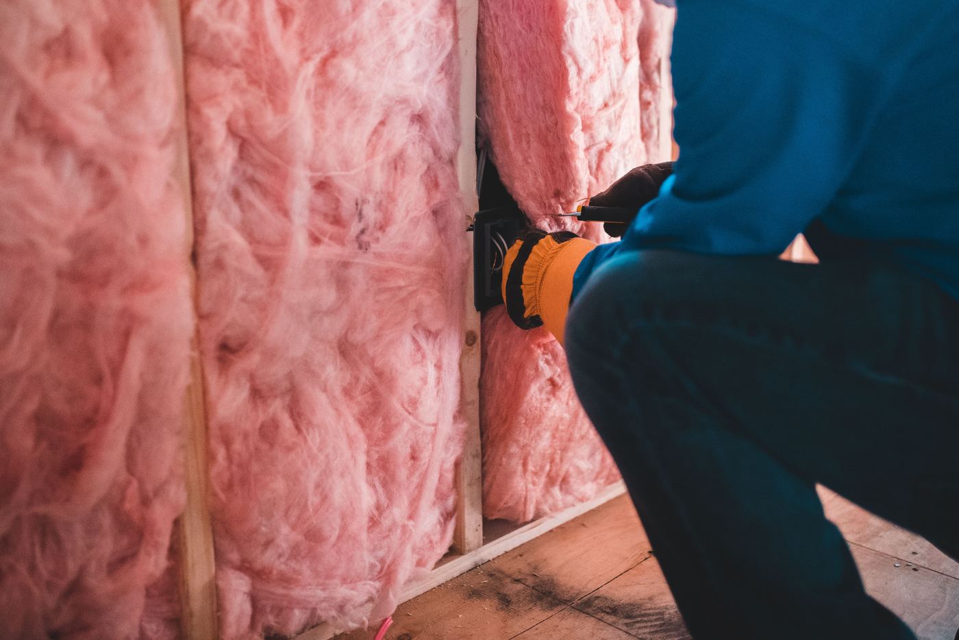 Batt insulation installed between wall studs in a home